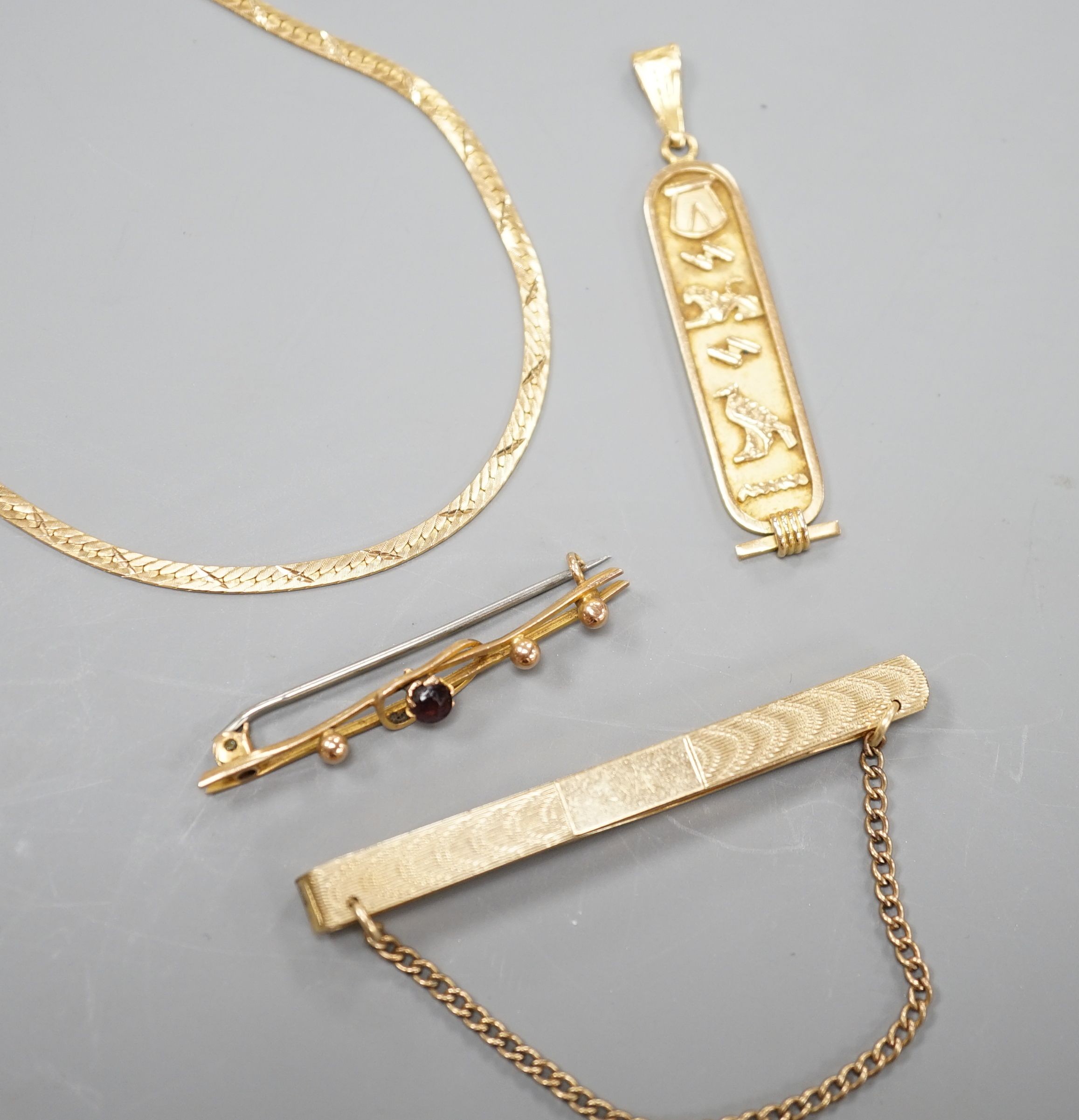 A Middle Eastern pendant and bracelet, gross 6.5 grams, together with a 9ct bar brooch and a rolled gold tie clip.